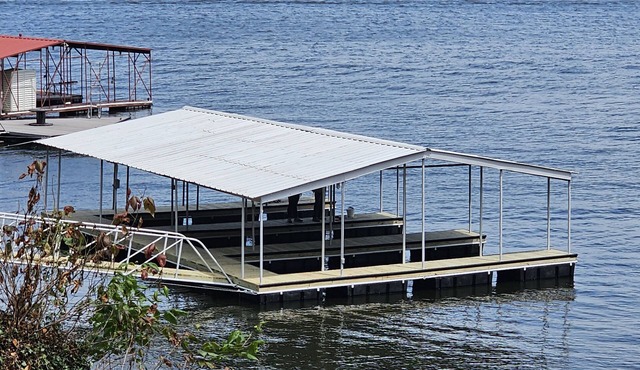 Hot tub, boat dock and lakeside with this snug small cabin. TINY BEDROOMS
