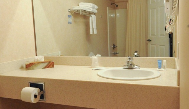 Hotel room with TWO QUEEN BEDS and attached, private bathroom.