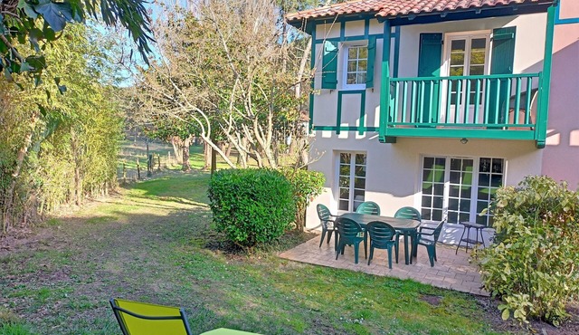House among the pines between golf course and beach