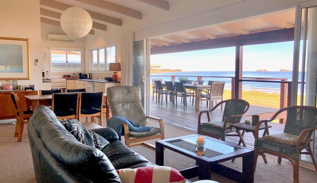 House at the beach, the sounds of waves on the breeze