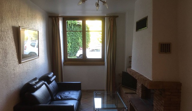 house between countryside and mountains