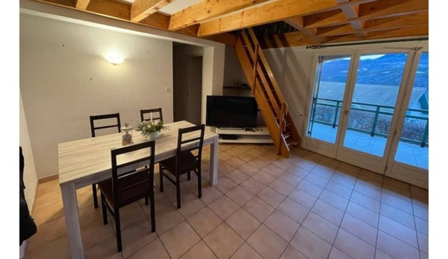 House between lake and mountain