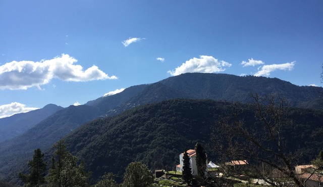 House between sea and mountains