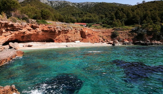 House Gnjila in the bay above the beautiful beach in Gromin Dolac