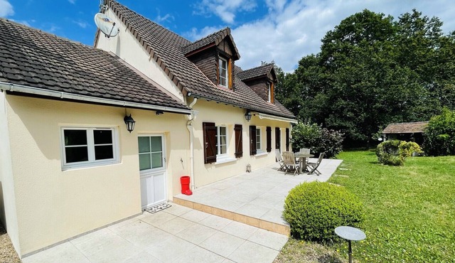 House in a green setting with swimming pool