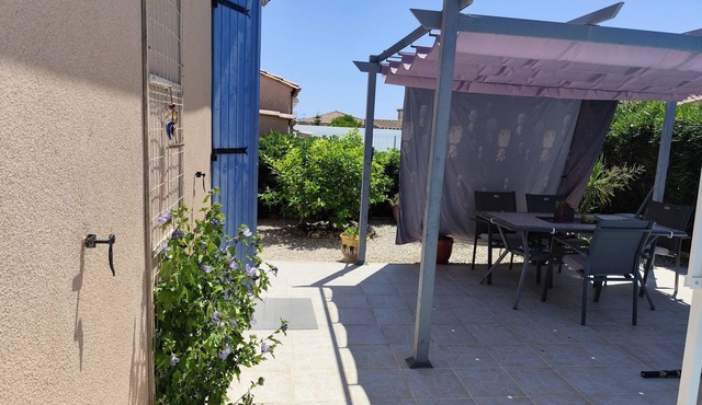 House in a residence with its own swimming pool.