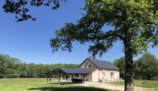 House in the heart of a clearing in the forest with private pond for fishing
