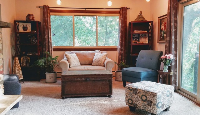 House in the trees with City View