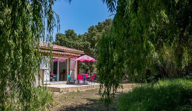 house located in a haven of greenery 15 minutes walk from the beach of Maora