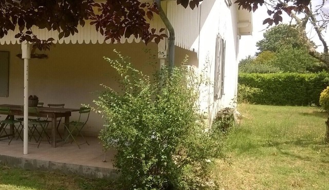 house near ocean with large garden