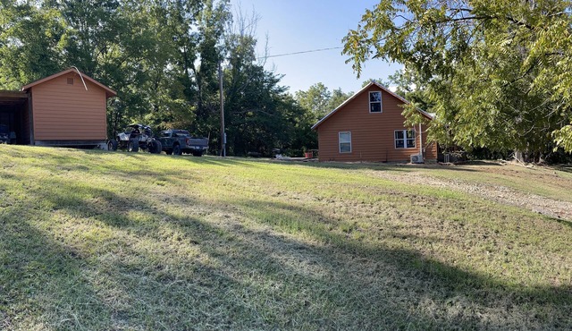 House on 80 acres that connect into the off road park! Extra cabins available.