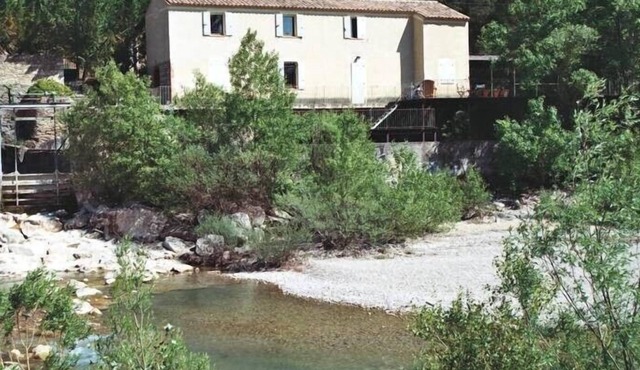 House on exceptional site in immediate edge of river.