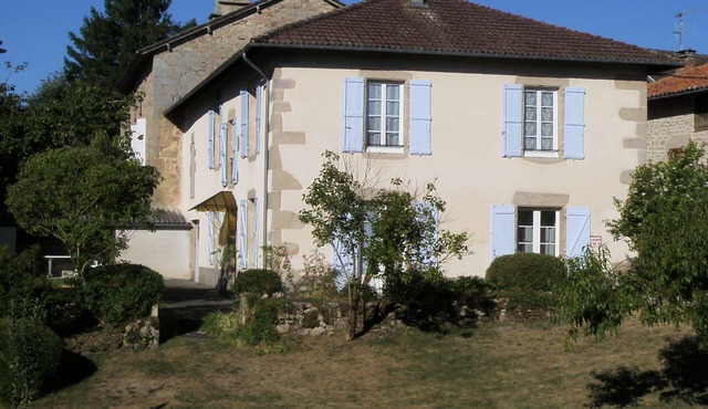 House with fenced garden in village