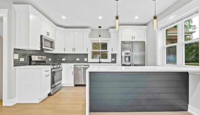 House with garage, outdoor dining and basement bar