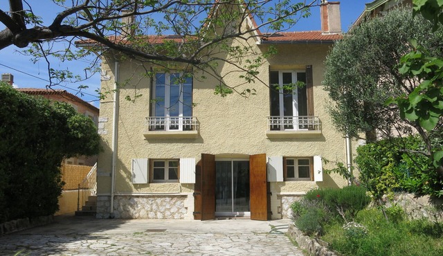 House with garden on a hill