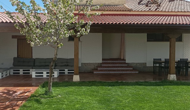 House with large garden and fireplace, ideal for families, pet friendly.
