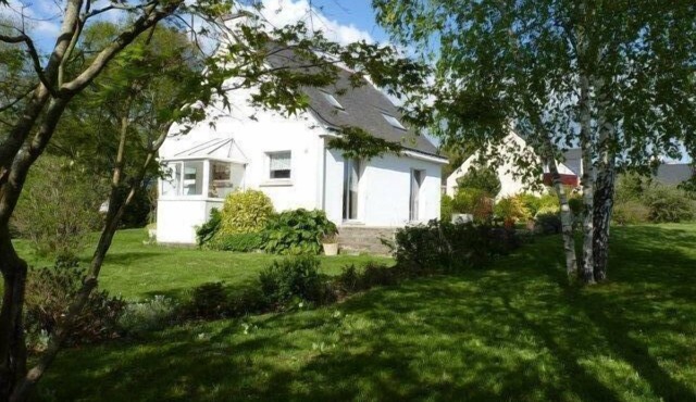 House with large terrace and fenced garden