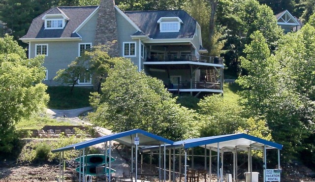 Huge Lakeside Lodge has stunning views and an easy walk to its big dock!