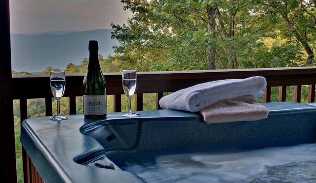 Hummingbird Haven is the ultimate retreat for large groups! Enjoy pet-friendly accommodations, breathtaking mountain views, a hot tub, firepit, WiFi, and hiking