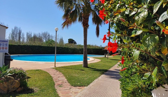 Ibiza-style vacation home with terrace right on the beach. Great pools.