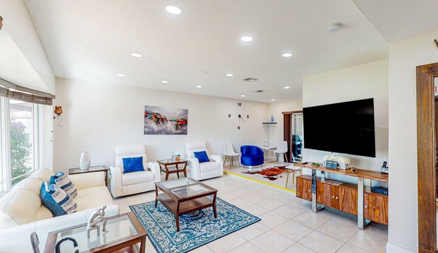 Ideally located home with enclosed pool, grill, W/D, & AC - snowbird-friendly