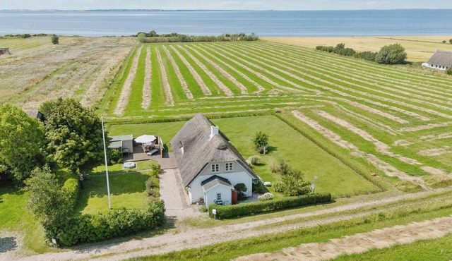 Idyllic thatched cottage with sea view