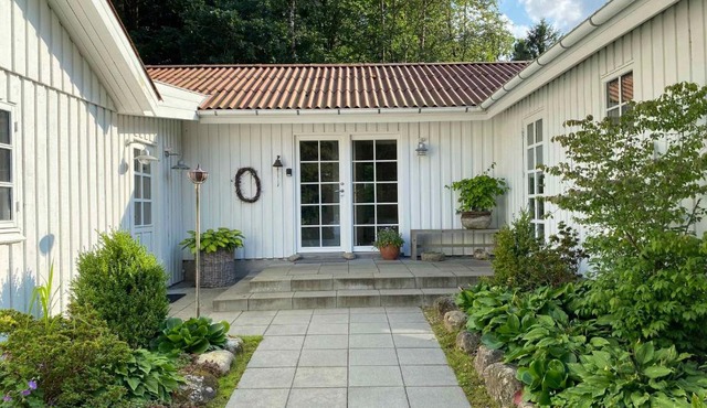 Idyllically Situated Wooden House By The Forest