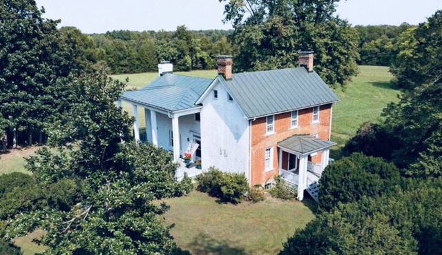 Immaculate 1902 Farmhouse on 10 private acres.