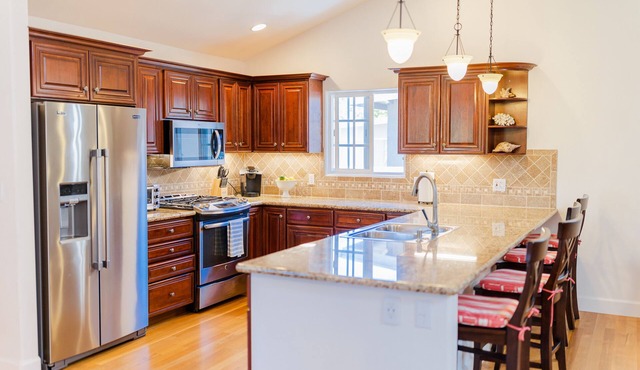 Immaculate Single Level Spanish Style Home Nestled near the Beach & Sunset Park