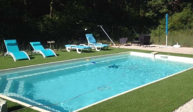 In a forest, in a haven of greenery with private swimming pool.