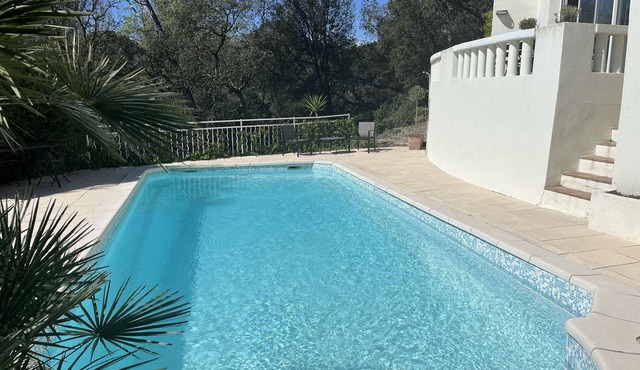 In a green setting, architect villa with swimming pool