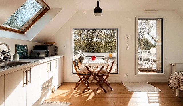 In a green setting close to the ocean