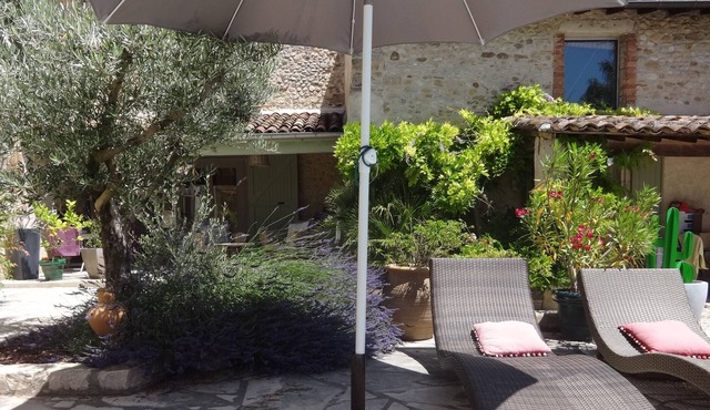 In a green setting, charming cottage with pool