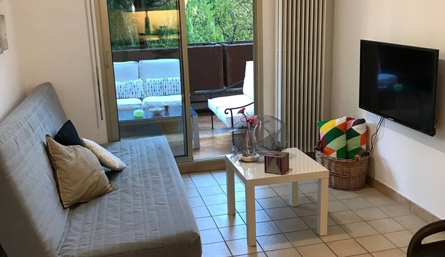 In a green setting with air conditioning, swimming pool and tennis court