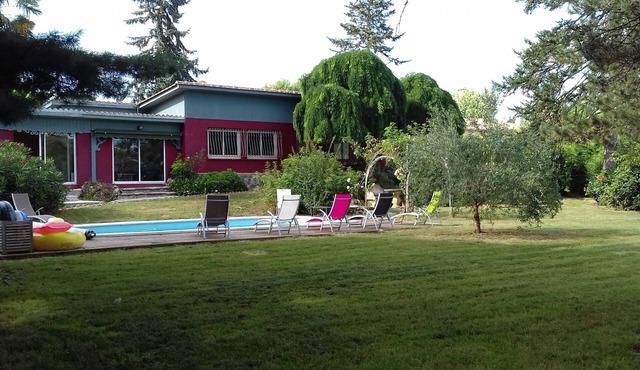 In a large enclosed park, quiet family home on the river bank,