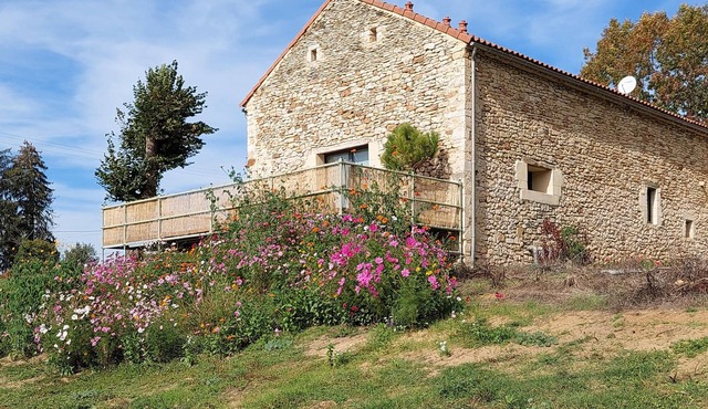 In a rural location, this tasteful stone house welcomes you.
