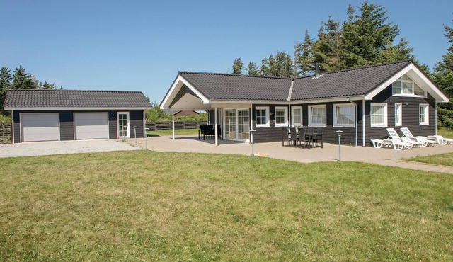 In beautiful nature, not far from the sea and sandy beach, lies this luxury house.