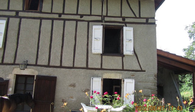 In the green a half-timbered house with soothing lights.