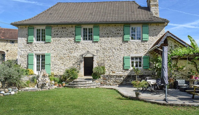 In the midst of beautiful nature welcomes you this gorgeous farmhouse with beautiful garden.