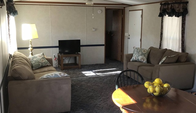 In-town home, walk to restaurants; property borders scenic hiking trail.