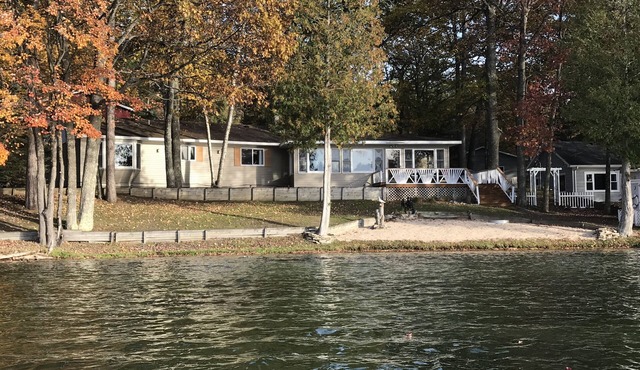 Incredible sunsets await in this Northern Michigan Lake front home.