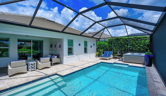 Indulge in a lavish home, heated saltwater pool, & spa, near all Naples offers.