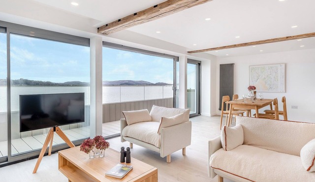 Indulge in seaside luxury at this immaculate first and second floor apartment.