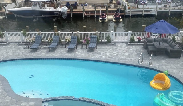 INGROUND POOL with CHILD SAFETY FENCE. Walking distance to BEACH. DOG friendly