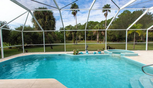 Inviting 3/2 Pool Home nestled in a peaceful, pristine neighborhood
