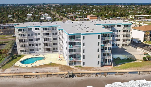 Inviting condo with ocean view, balcony, full kitchen, central AC, & W/D