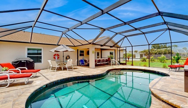 Inviting home w/screened pool, lovely patio & upgraded interior - beach nearby