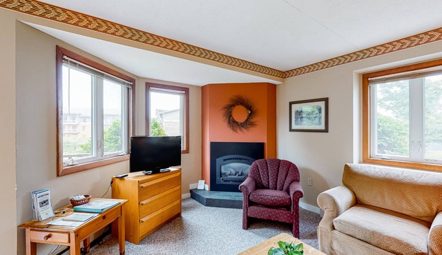 Inviting ski-in/out condo with mountain view, fireplace, deck & washer/dryer