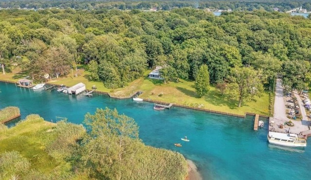 Island, house cottage. Lakefront property with boatlift and seawall.