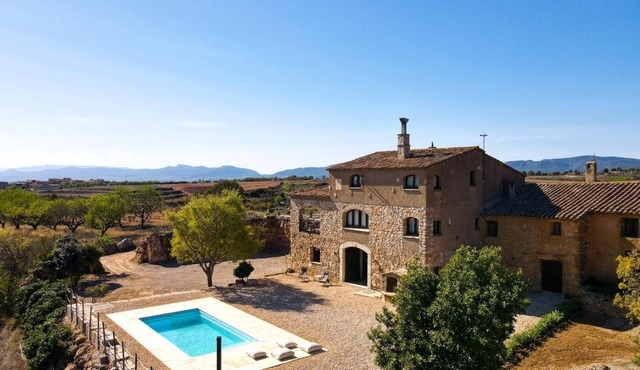 Isolated farmhouse surrounded, vineyards, olive trees and forest